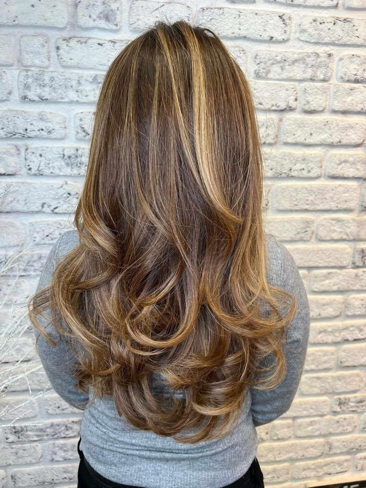 Soft bronde balayage with curls, back view, at The Establishment Hairdressing, Farnham