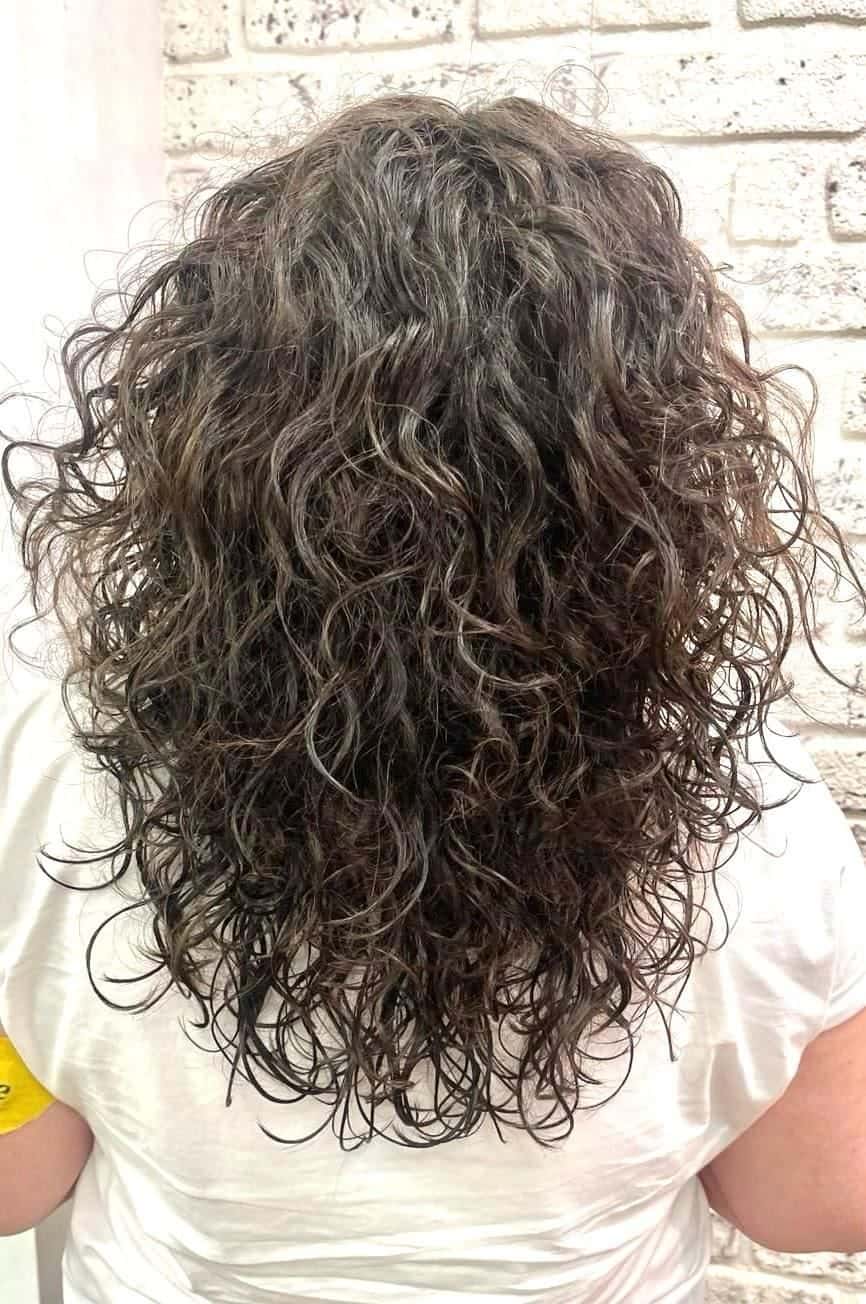 Natural curly hair cut and styled to enhance its own texture at The Establishment Hairdressing, Farnham