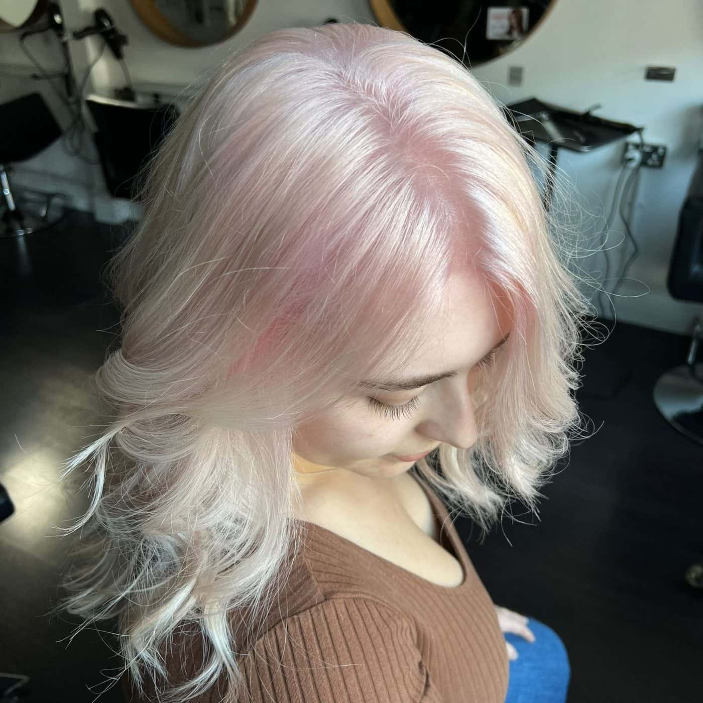 Close-up of pale pink and silver hair colour styled at The Establishment Hairdressing, Farnham