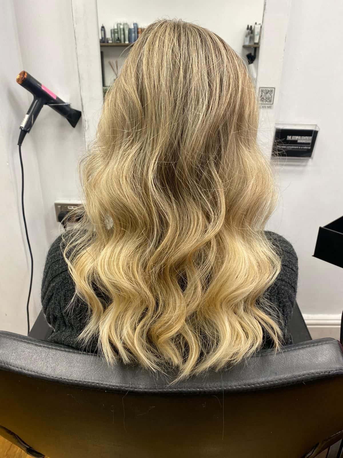 Soft natural blonde waves, a lived-in colour result, at The Establishment Hairdressing, Farnham