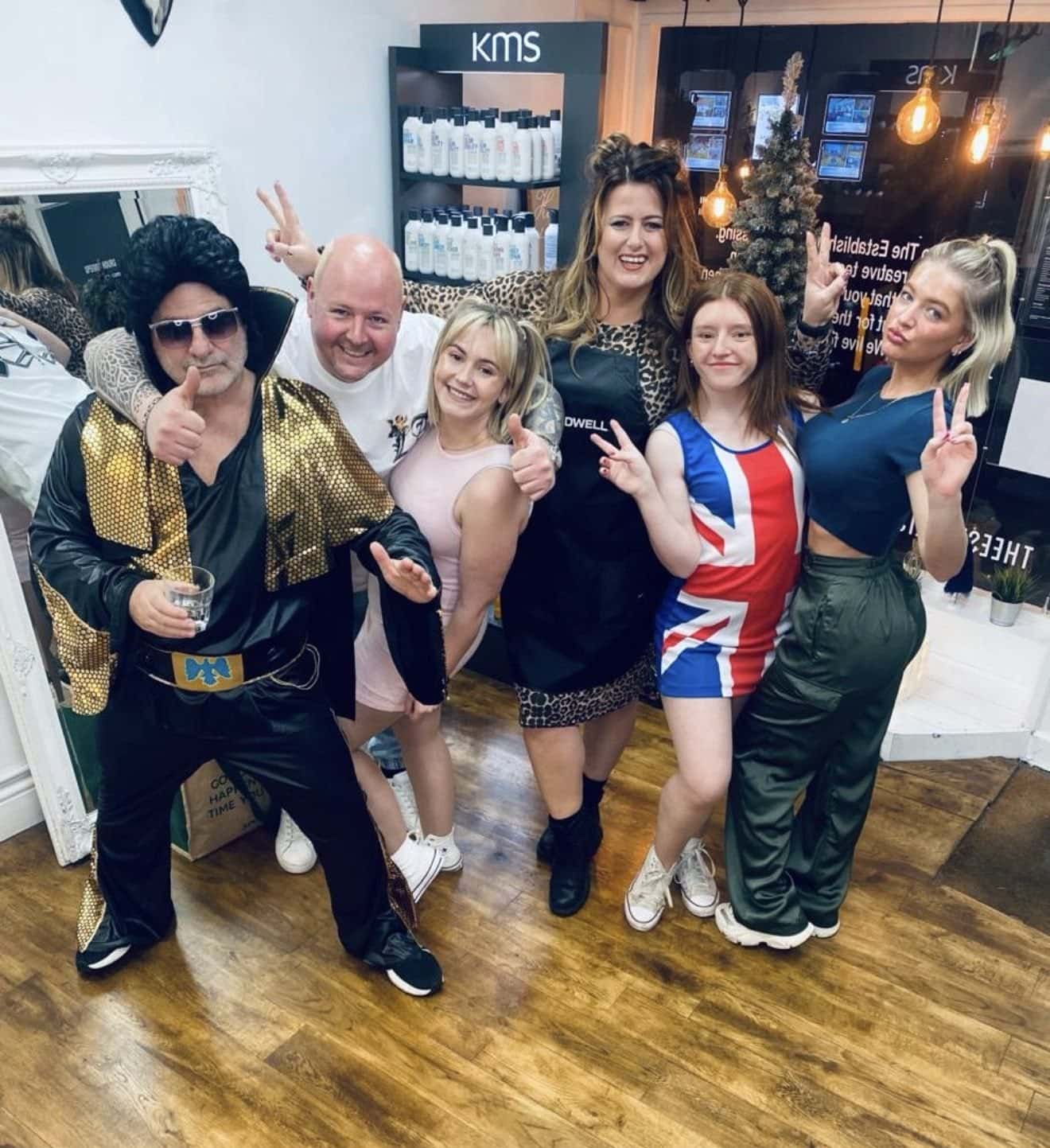 The Establishment Hairdressing team in fancy dress - Ross as Elvis with the rest of the team - celebrating together in the Farnham salon