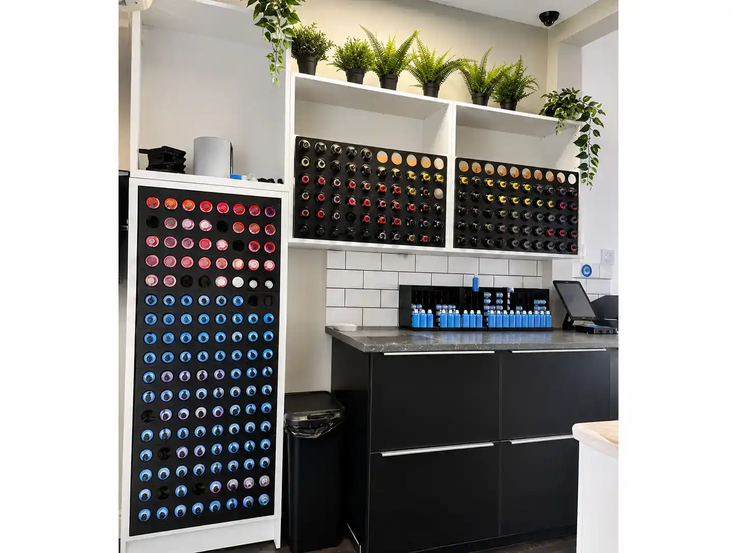 Goldwell professional hair colour mixing station at The Establishment Hairdressing, Farnham · rows of colour tubes and pigments