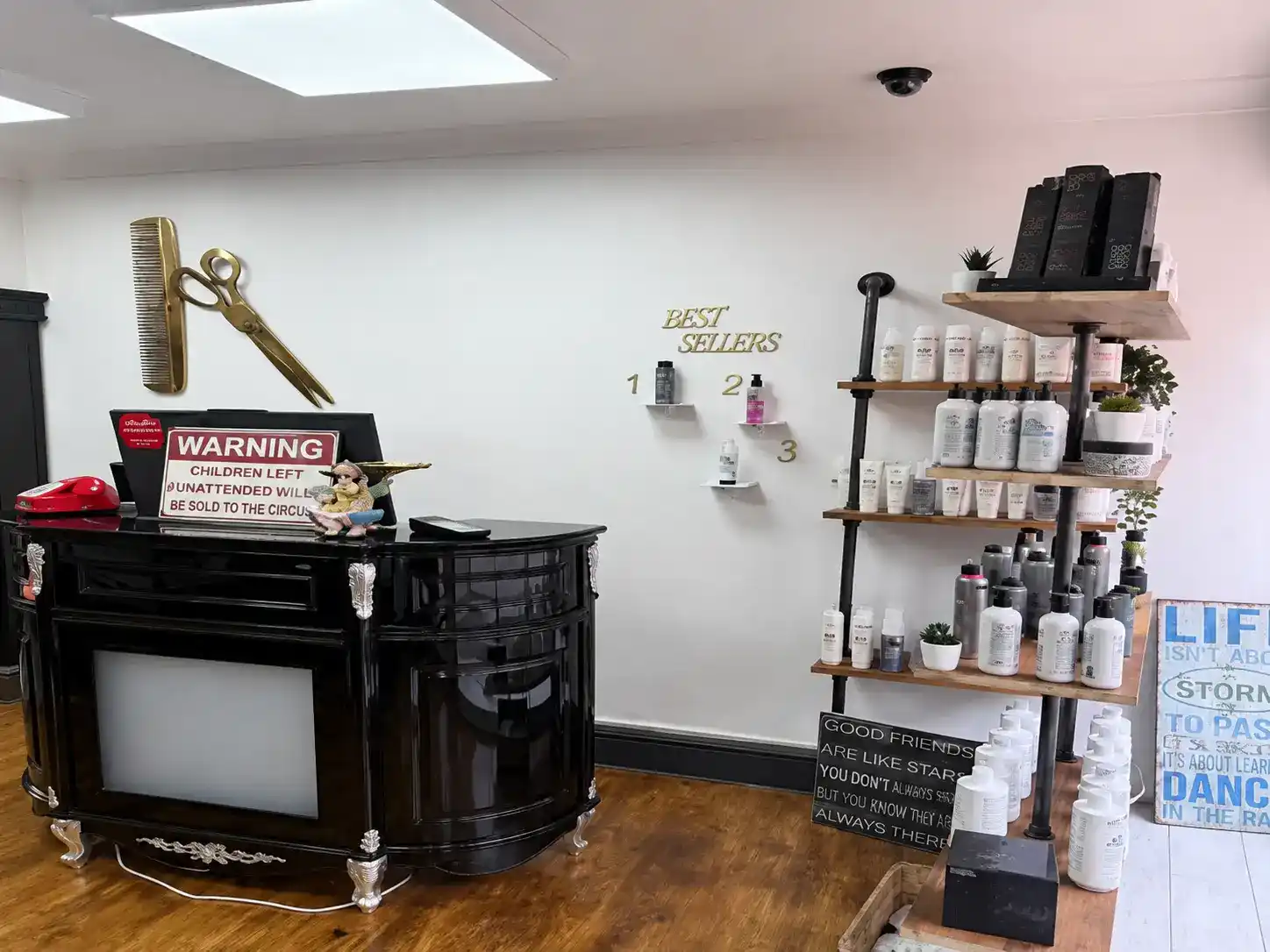 Gold scissors and reception desk at The Establishment Hairdressing, Farnham