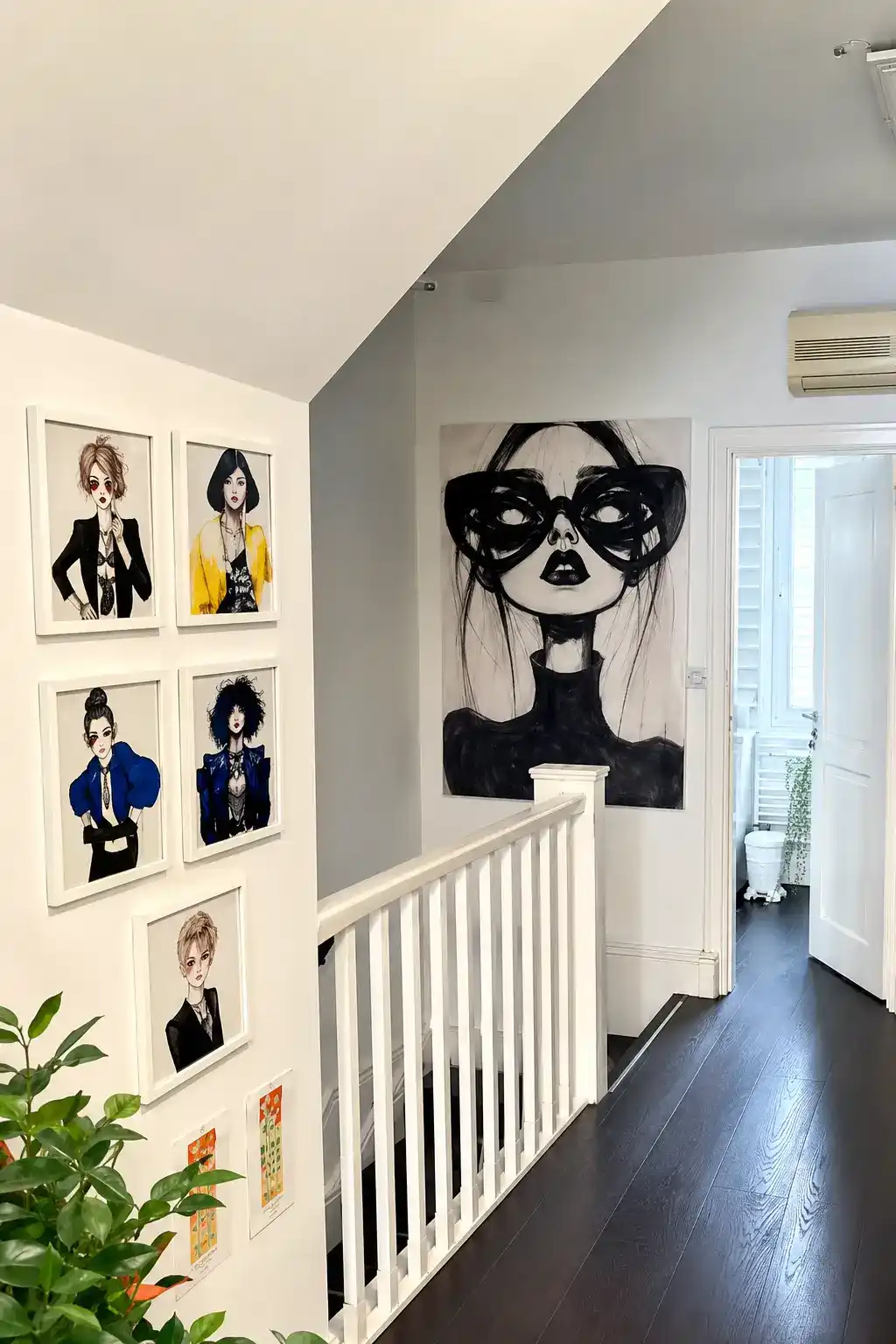 Upper floor gallery at The Establishment Hairdressing with fashion illustration artwork and large portrait